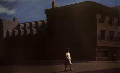 A lone women is silhouetted against a brown factory building